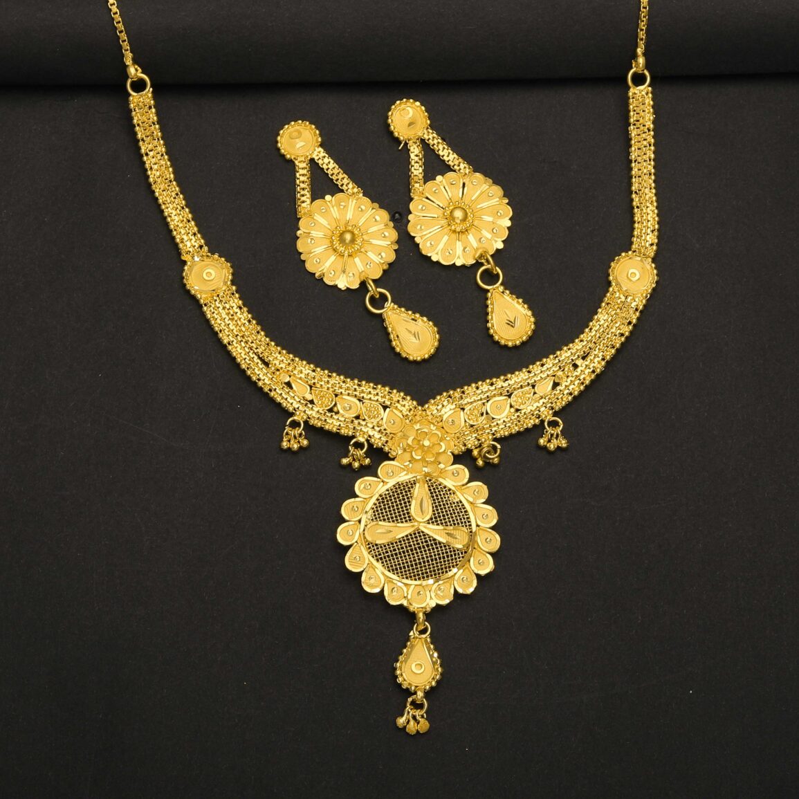 Flower type gold placed necklace with ear rings