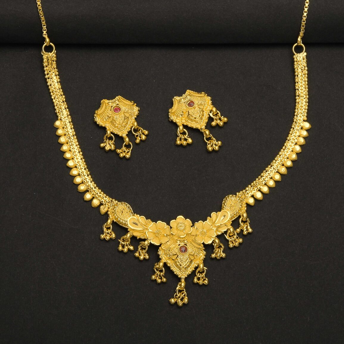 Gold plated necklace with red stone